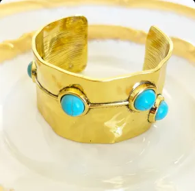 Chunky gold cuff statement bracelet.